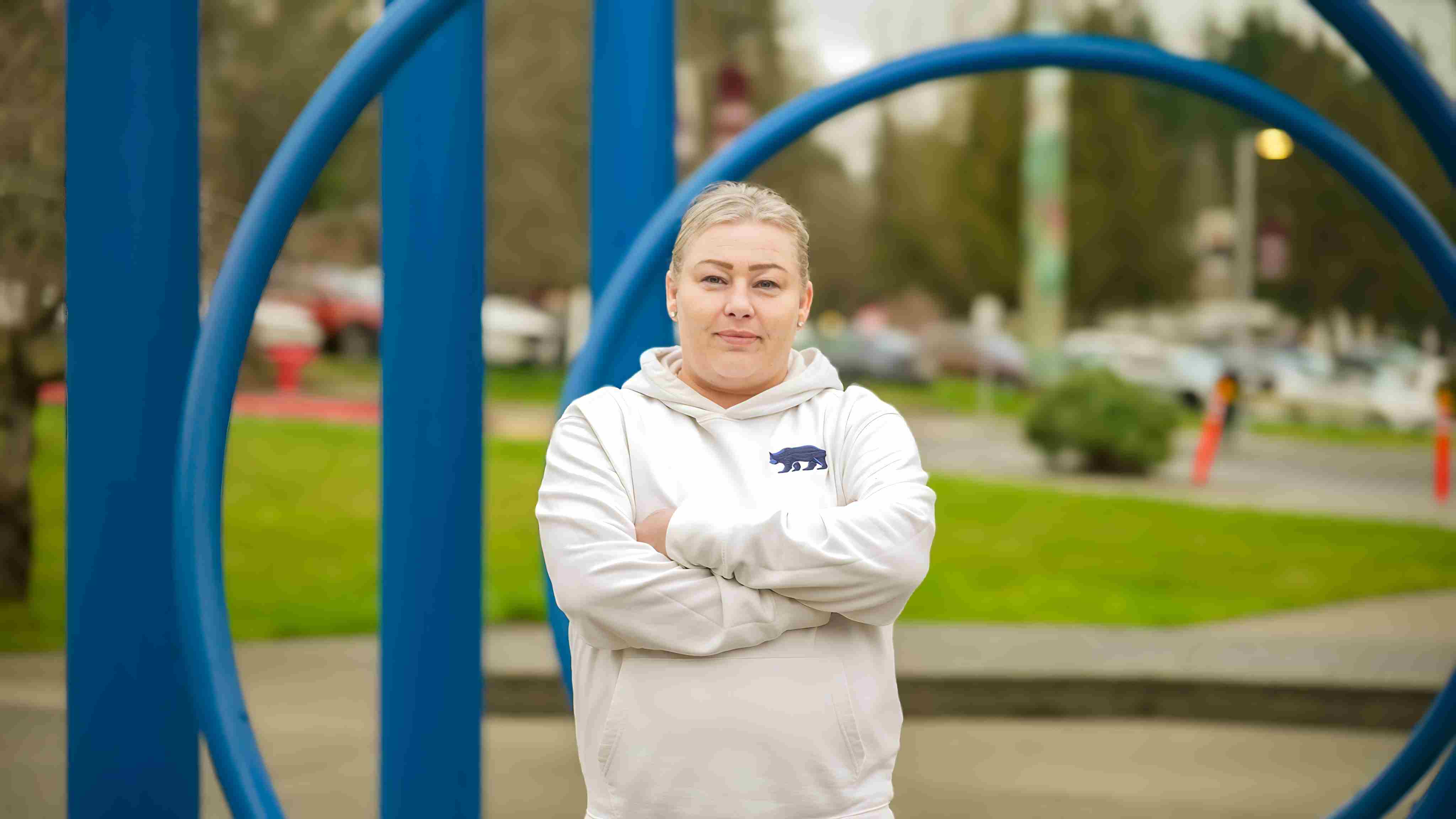 RTC student Melissa Nguyen in front of RTC's blue sculpture