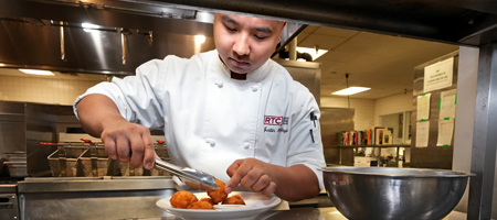 Culinary Student plating hush puppies