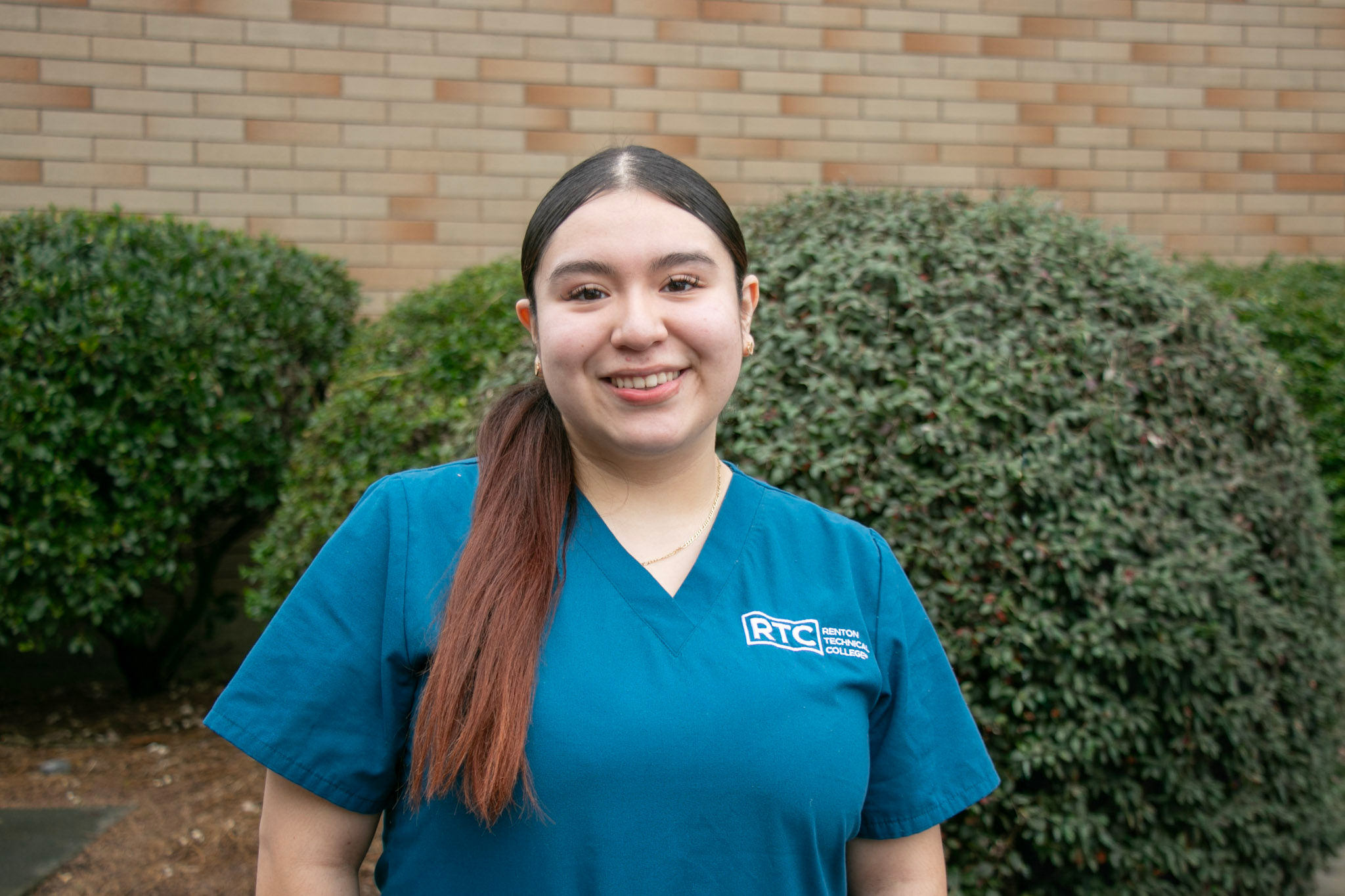 Valeria Hurtado-Gonzalez smiling outside of an RTC building