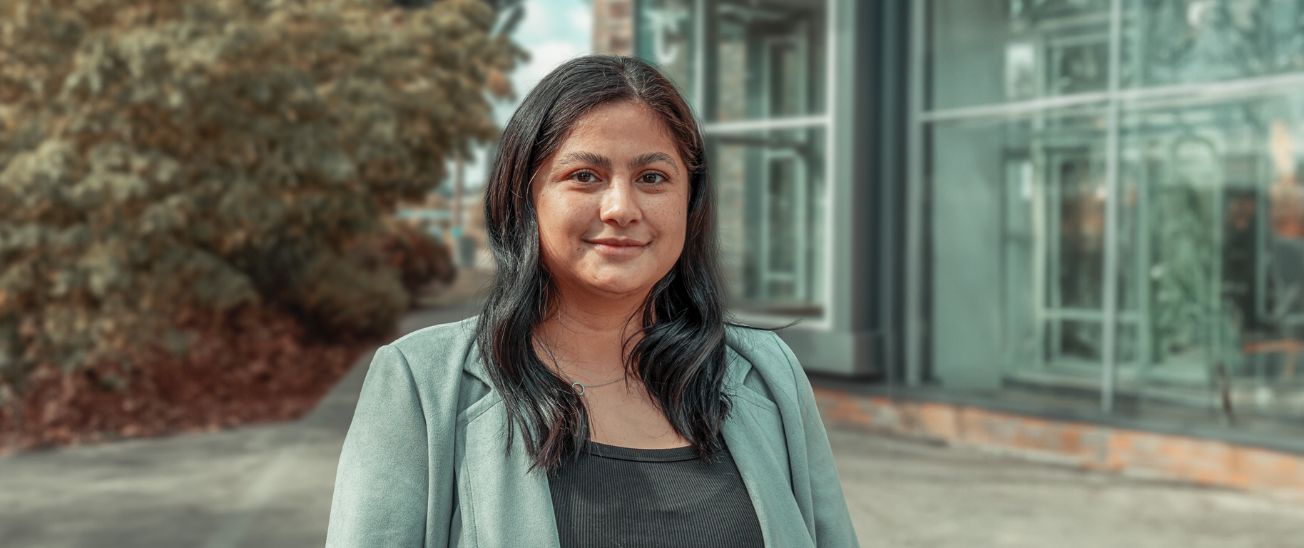 A woman standing in front of Building C