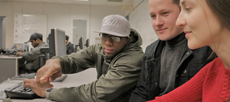 Compuiter Science students discussing software user interface