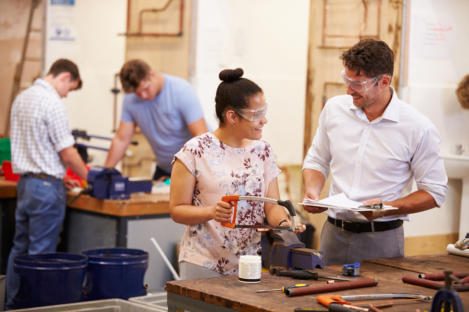Two people working in a tool shop.
