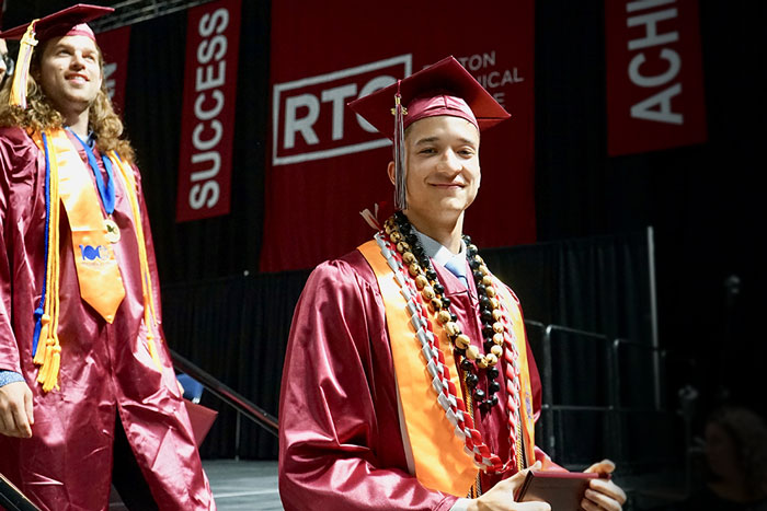 student in commencement gown 