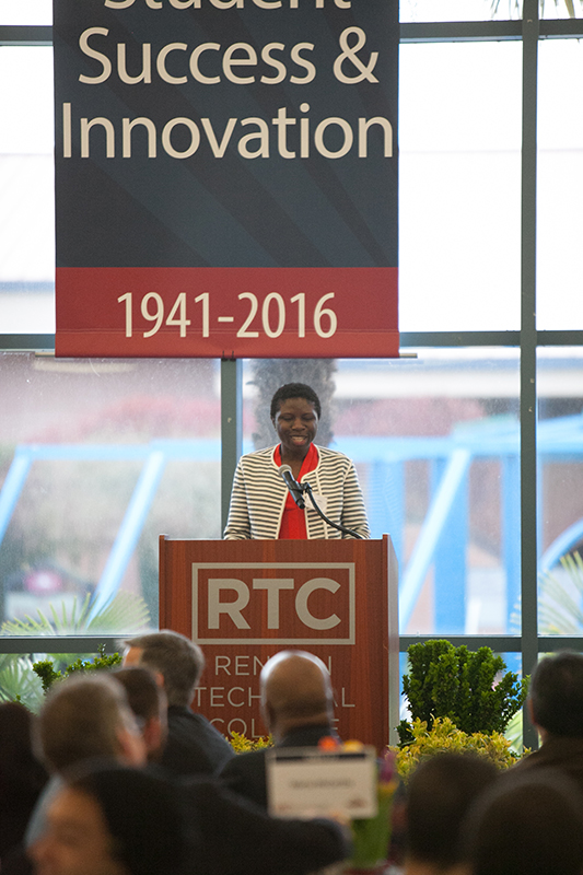 Photo of Kiwi Ijiomah at the podium.
