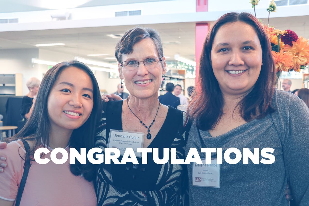 RTC Retired Faculty Barbara Culler smiles to the camera with two females students on her left and right.
