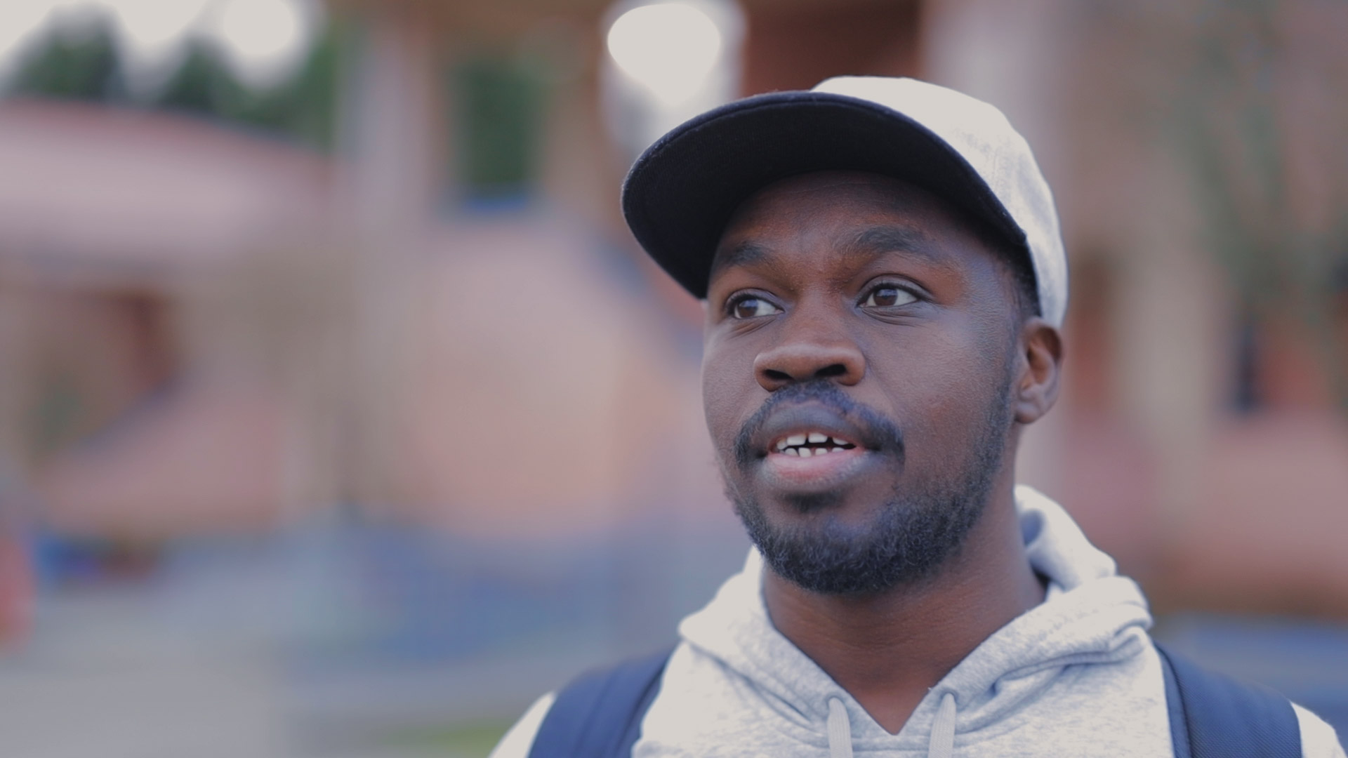 Headshot of computer science student Mustafa Musa wearing a baseball cap