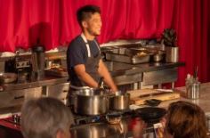 Chef Shota talks with dinner guests during his food demonstration