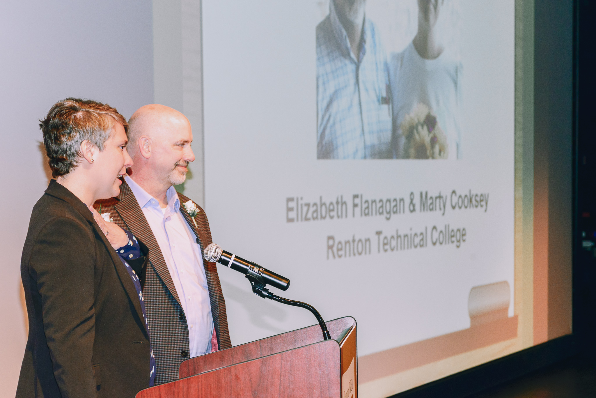 Elizabeth and Marty speaking from the podium